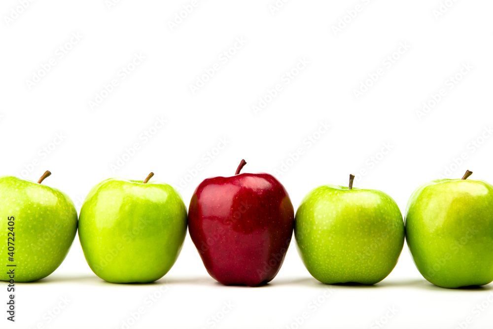 Red apple among green apples isolated on a white Red apple among green apples isolated on a white