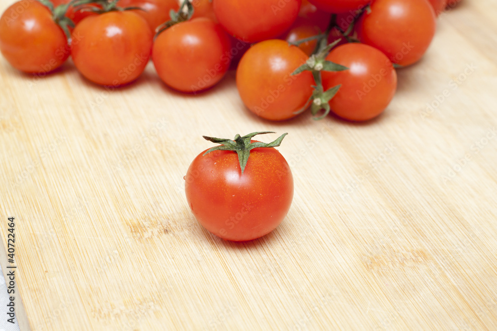 Cherry tomatoes on a board Cherry tomatoes on a board