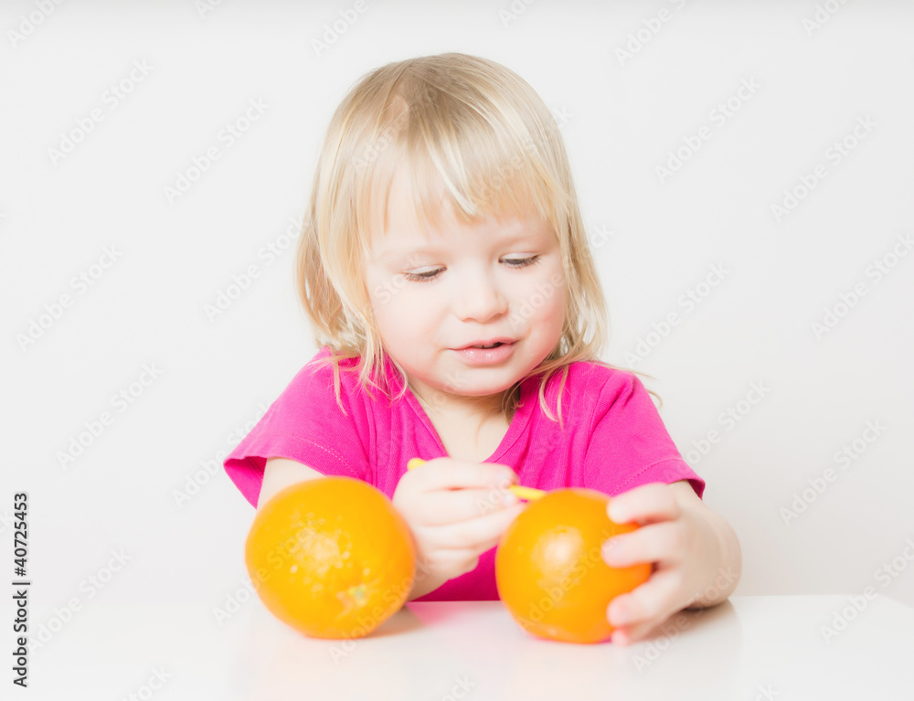 Adorable baby suck juice from orange with straw Adorable baby suck juice from orange with straw