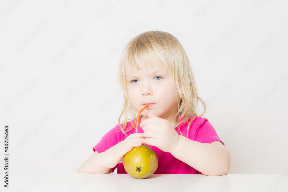 Adorable baby suck juice from pear with straw Adorable baby suck juice from pear with straw