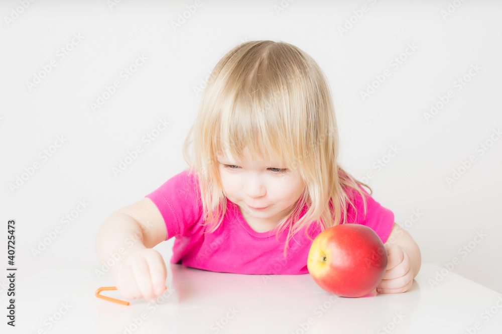 Adorable baby suck juice from apple with straw Adorable baby suck juice from apple with straw