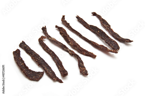 South African biltong strips  isolated on a white background