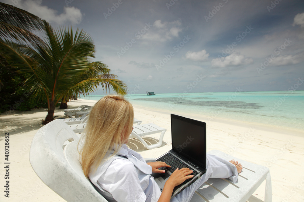 tropical business woman with laptop