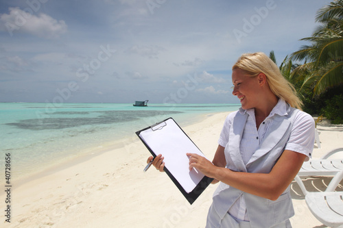 business woman with blank paper on the ocean coast