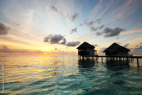 maldivian houses on sunrise © yellowj