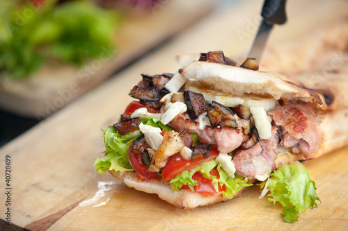 Italian Sandwich with Sausage and Eggplant and Provola cheese photo