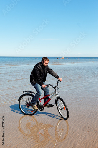 Cyclist at sea.