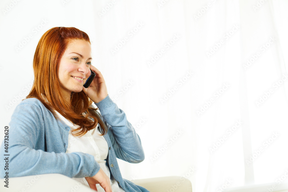 Beautiful woman smiling and using a mobile phone Beautiful woman smiling and using a mobile phone