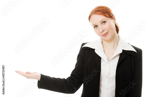 A young beautiful business woman pointing