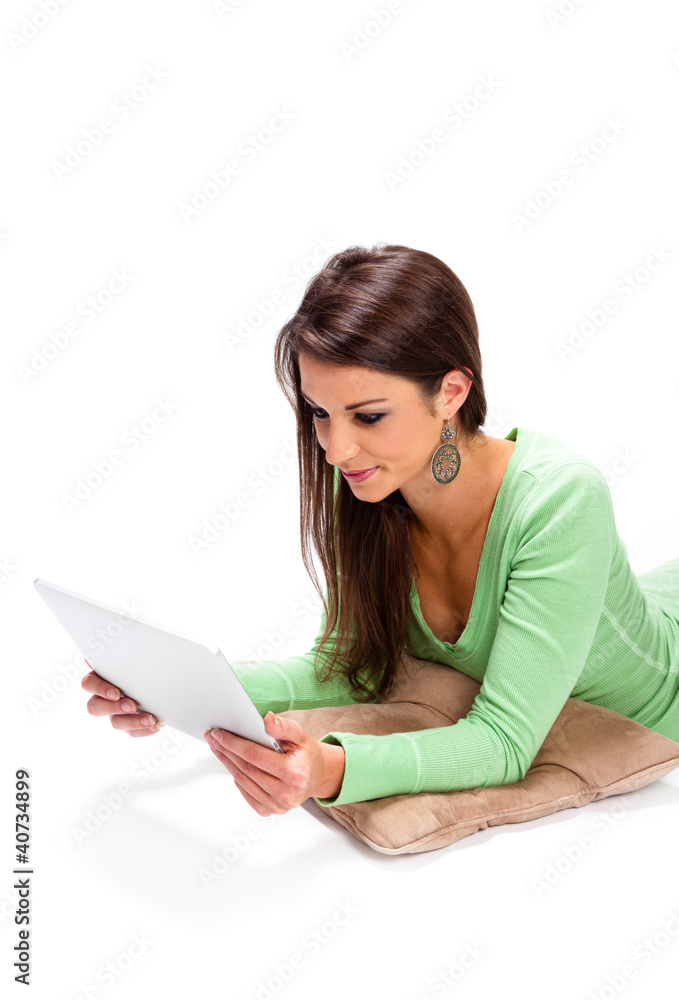 Pretty woman video chats on her touchscreen tablet Pretty woman video chats on her touchscreen tablet