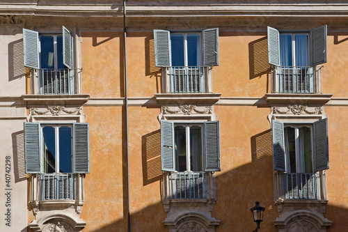 typical italian facade with windows, rome, italy