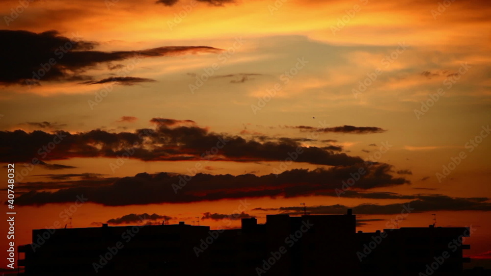 Red clouds in the sky with build on background (timelapse) Red clouds in the sky with build on background (timelapse)