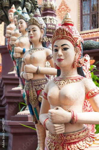 Apsara sculptures at Cambodian temple photo