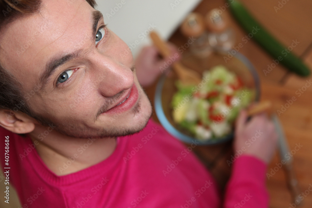 Young man tossing a salad Young man tossing a salad