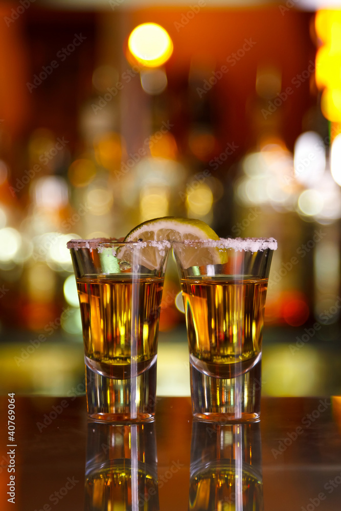 two shots of tequila with lime and salt two shots of tequila with lime and salt