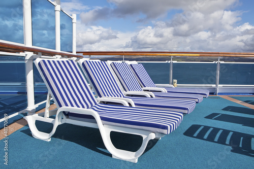Roe of deck chairs on sundeck of the cruise ship © -Marcus-