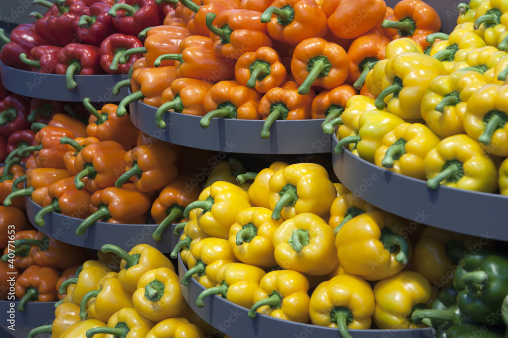 Piles of red, orange, yellow and green peppers Piles of red, orange, yellow and green peppers