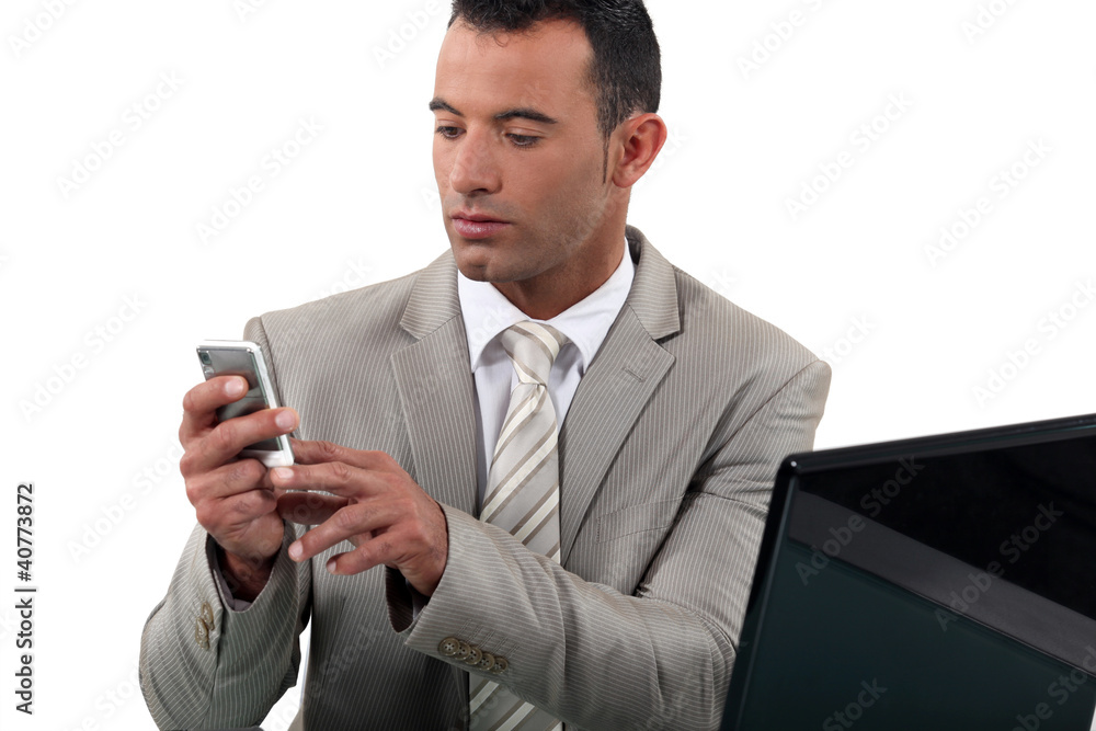 Businessman looking at his phone Businessman looking at his phone