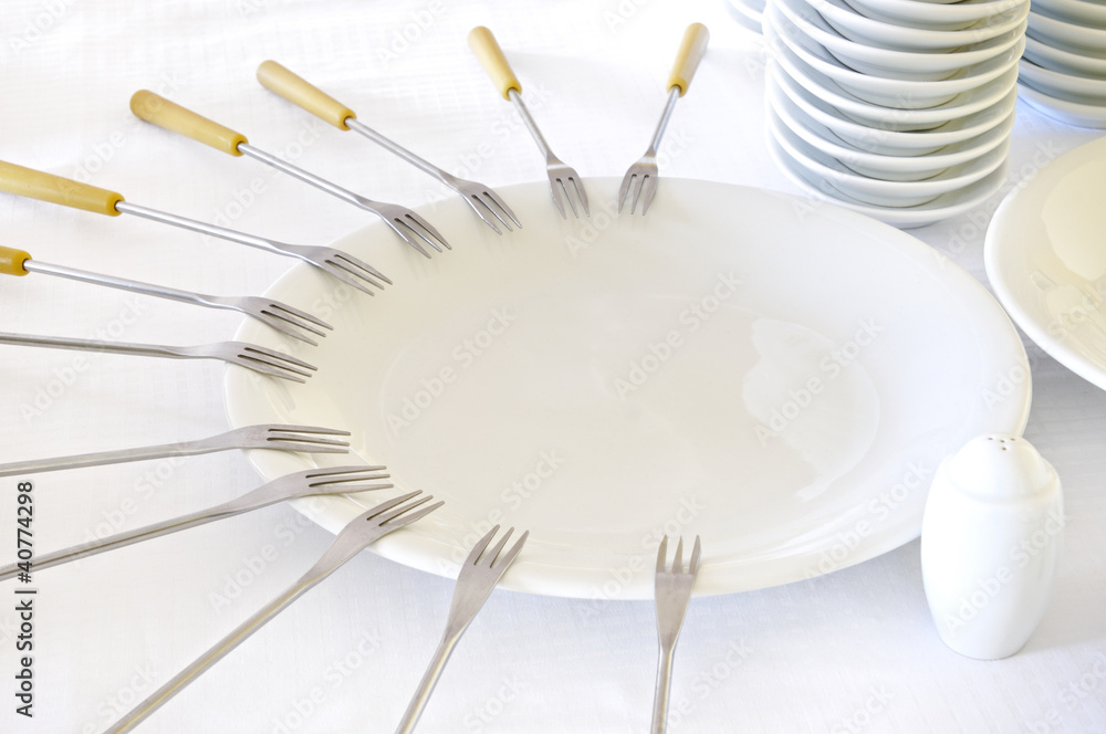 Empty plates with forks Empty plates with forks