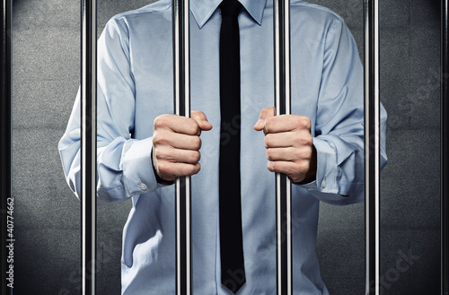 Картината върху платно Young corrupted businessman behind the prison bars