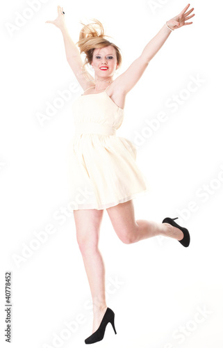 Young female Happy woman jumping with arms up isolated