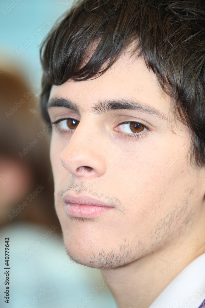 portrait of young man looking bored portrait of young man looking bored