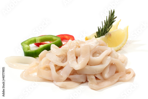 Pile of raw squid rings over white photo