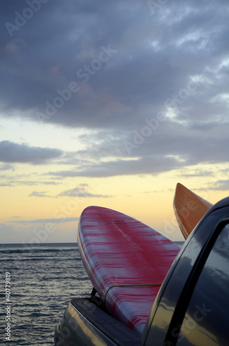 Two Surfboards In The Back Of A Truck At Sunset With Copy Space