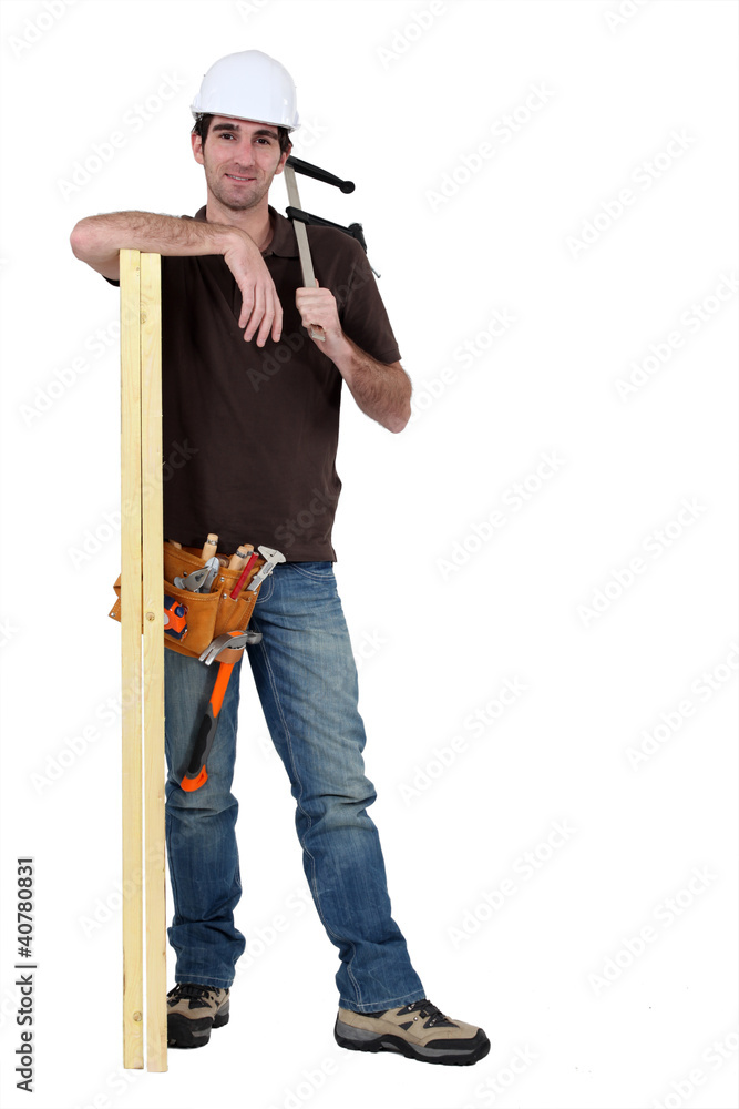 craftsman measuring a wooden board craftsman measuring a wooden board