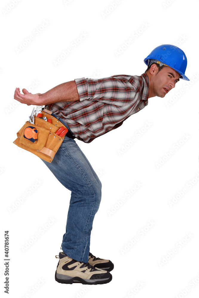 Construction worker carrying something heavy Construction worker carrying something heavy
