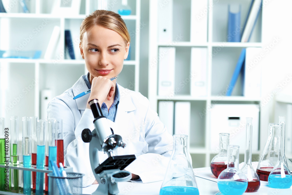 Young scientist working in laboratory Young scientist working in laboratory