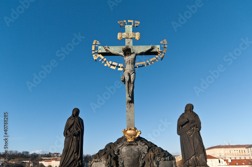 Religious detail of Charles' Bridge in Prague, Czech Republich photo