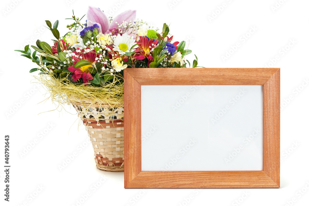 Wooden picture frame with flowers on white background Wooden picture frame with flowers on white background