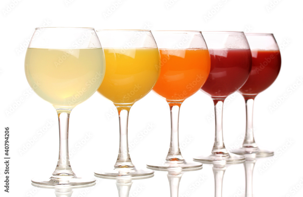 Tropical juices in glasses isolated on white Tropical juices in glasses isolated on white