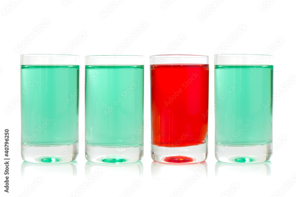 glasses with green and red liquid glasses with green and red liquid
