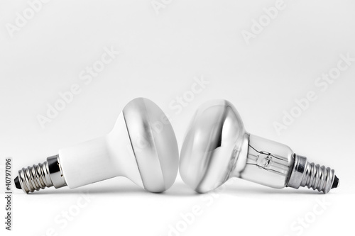 Energy saving and filament light bulbs on gray background