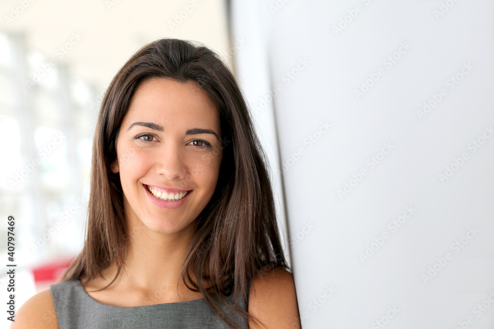 Portrait of beautiful businesswoman standing in hall Portrait of beautiful businesswoman standing in hall