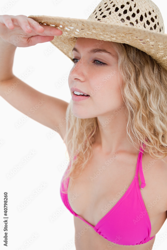 Attractive blonde woman trying to look far to the side Attractive blonde woman trying to look far to the side