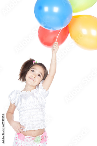 Little brunette girl with balloons in studio © Iuliia Metkalova