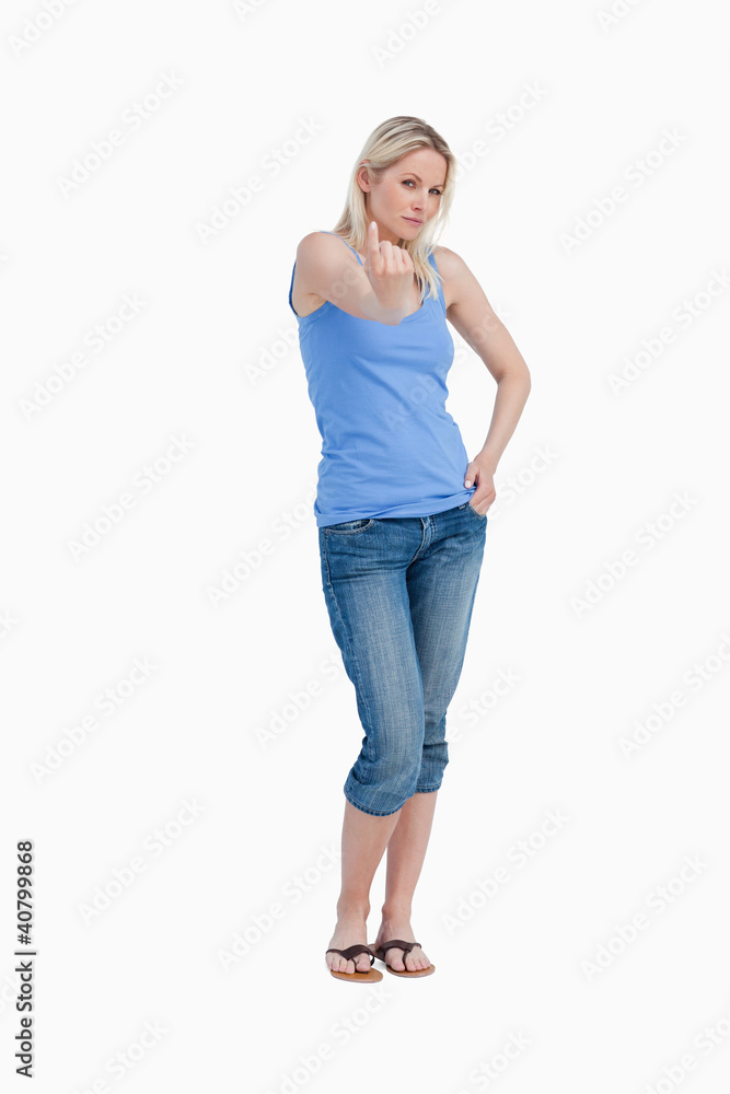 Serious woman telling to come on with her finger Serious woman telling to come on with her finger
