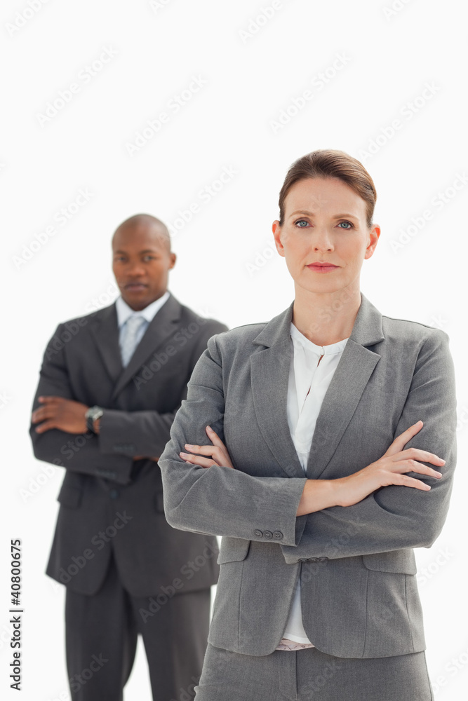 serious businesswoman in front of businessman serious businesswoman in front of businessman