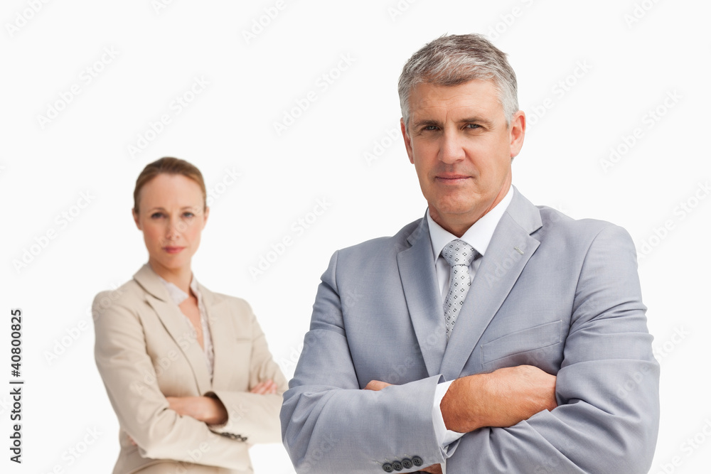 Two business people with folded arms Two business people with folded arms