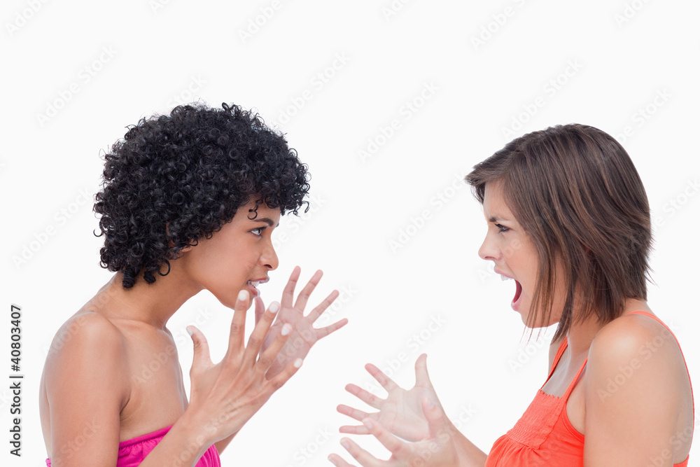 Teenagers standing upright while shouting Teenagers standing upright while shouting