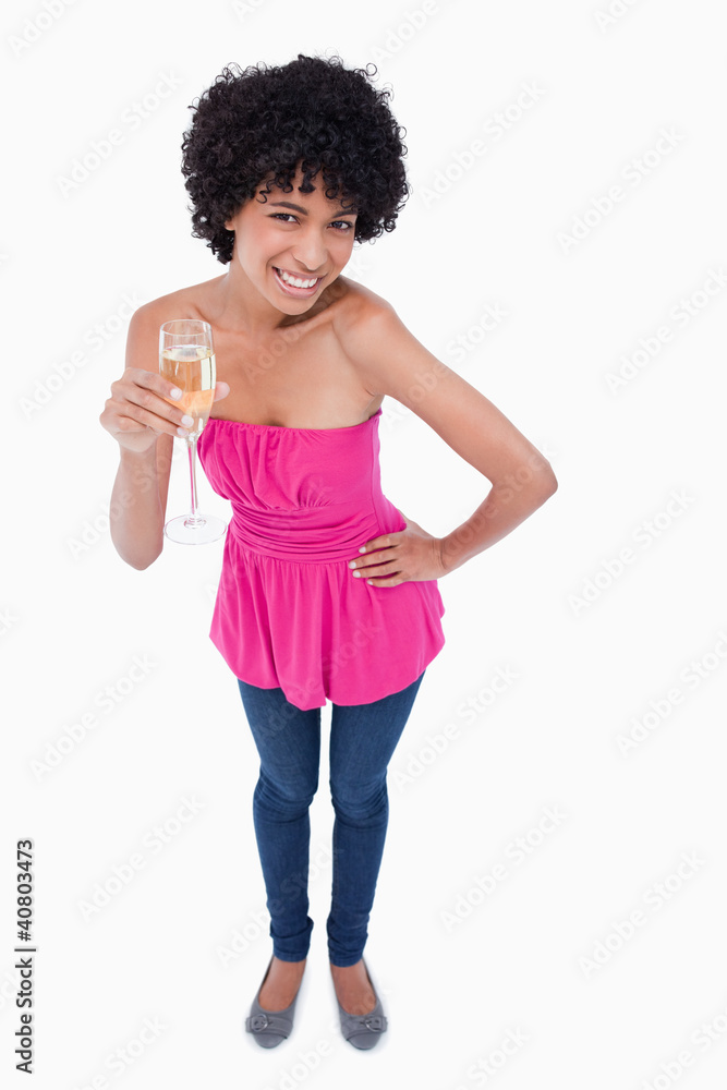 Young woman leaning her body forward while drinking white wine Young woman leaning her body forward while drinking white wine