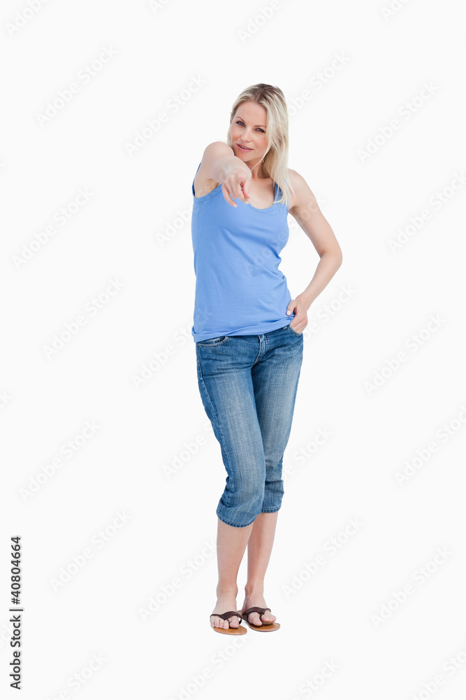Relaxed blonde woman pointing her finger Relaxed blonde woman pointing her finger