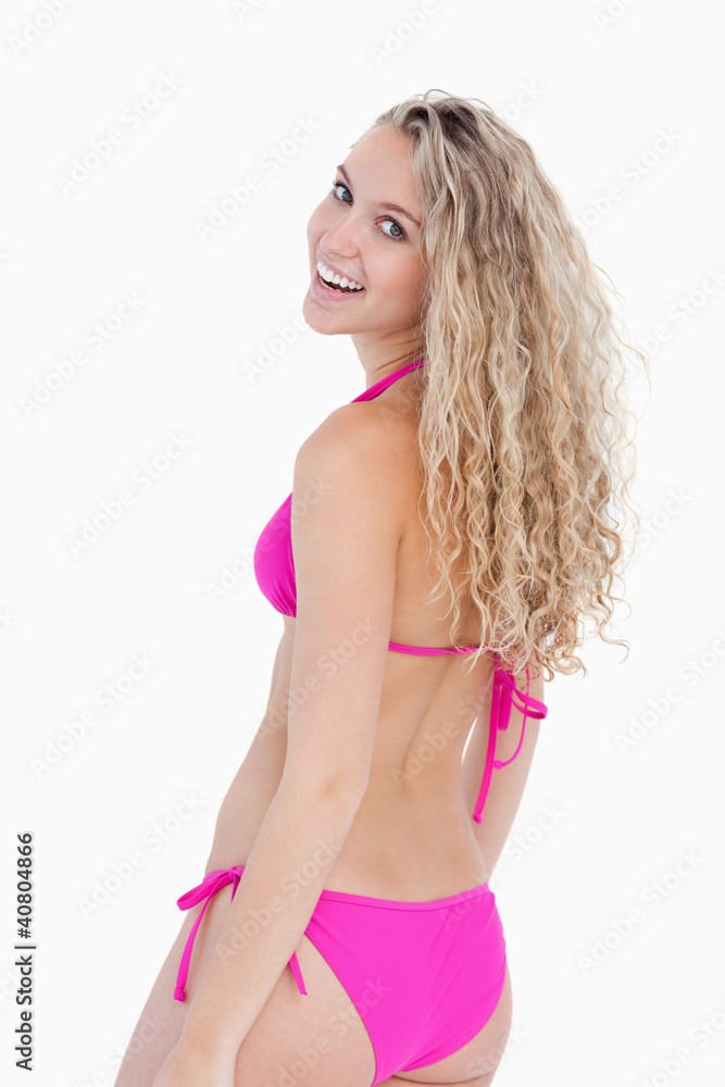 Young attractive woman turning her head back Young attractive woman turning her head back