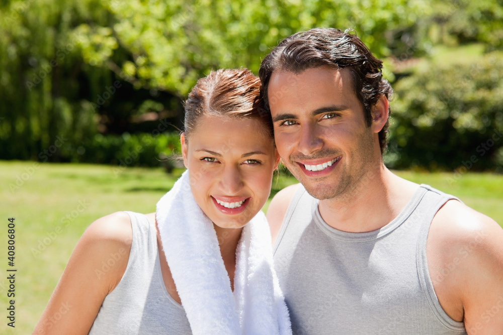 woman with and man smiling in workout gear woman with and man smiling in workout gear