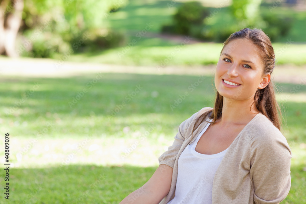 Smiling woman enjoying her day in the park Smiling woman enjoying her day in the park