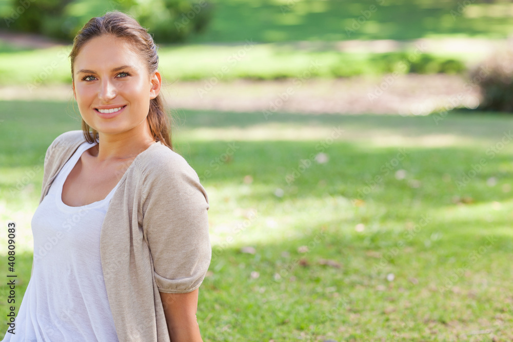 Smiling woman enjoying her time in the park Smiling woman enjoying her time in the park