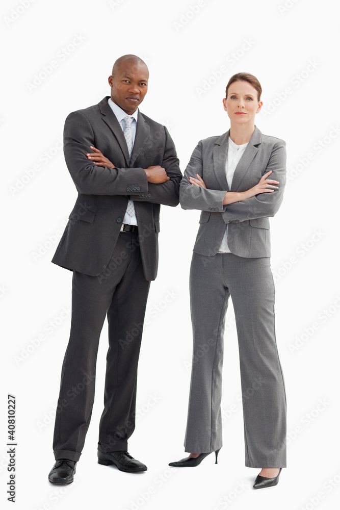 Business man and woman with hands crossed Business man and woman with hands crossed